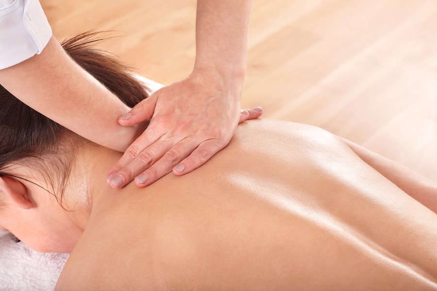 Young woman having back massage.